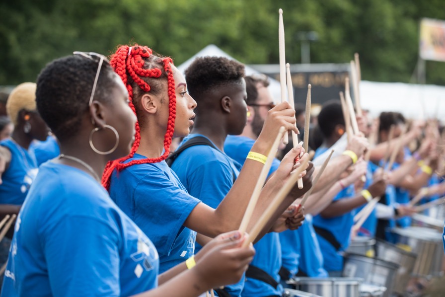 Drumworks (photo by Gar Powell-Evans) Young people from the Drumworks Exchanging Notes project performing outside.