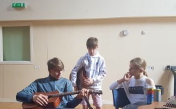 Musical Routes project - Kye teaching Reagan guitar 